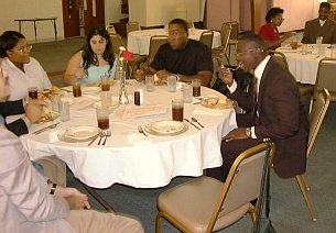 Drew taking a big bite of lasagne at the RAM banquet.